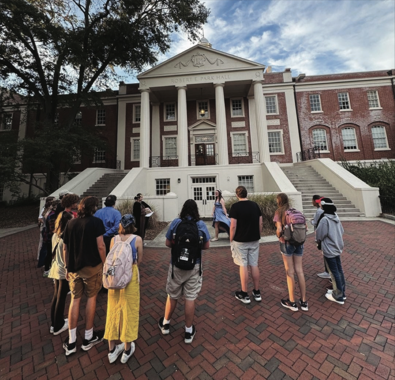 Students getting a campus tour, standing in front of Park Hall