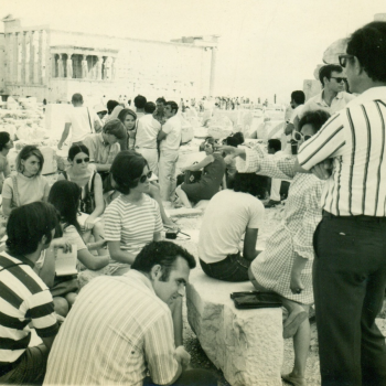 Dr. Ed Best lecturing on the Acropolis, Athens, Greece in front of the Parthenon,with a view of the Erectheum. 1970. 